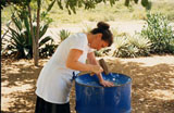 Carol works on her first "solo pan"